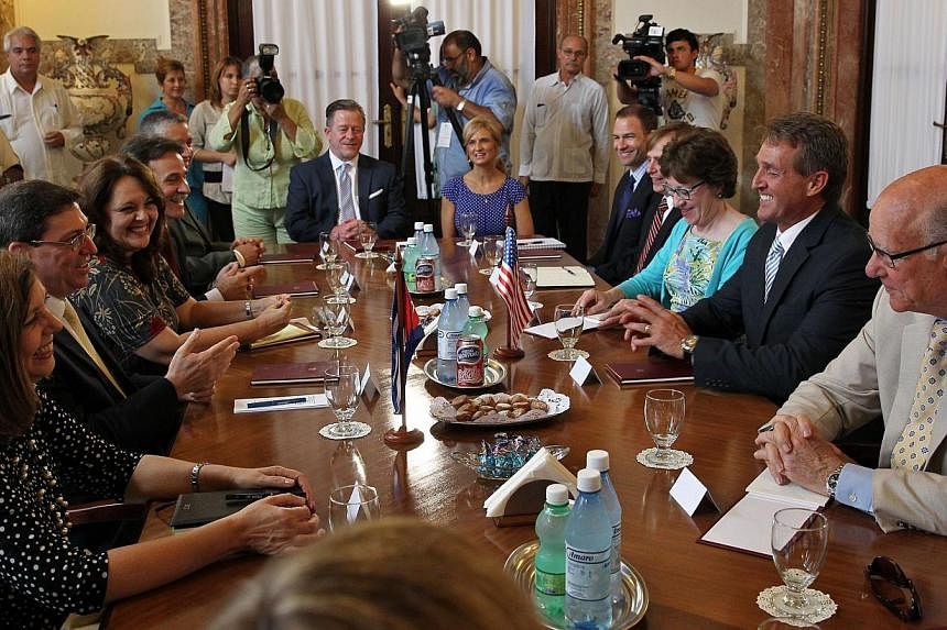 Cuban Foreign Minister Bruno Rodriguez (second left) meets members of a US delegation on June 13, 2015, in Havana. -- PHOTO: AFP