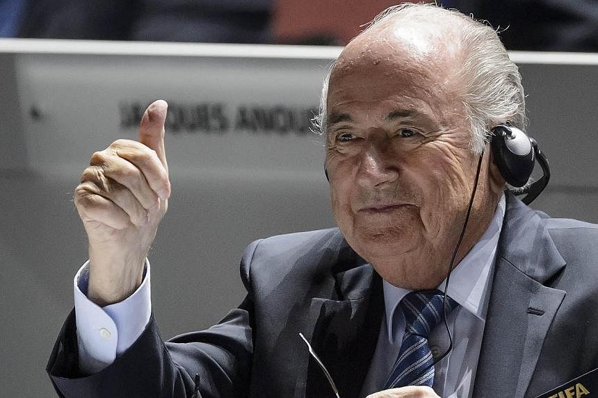Sepp Blatter gives a thumb up at the opening of the 65th Fifa Congress in Zurich on May 29, 2015. Blatter may seek to stay on as the president of Fifa, a Swiss newspaper quoted an anonymous source close to Blatter as saying on Sunday. -- PHOTO: AFP&n