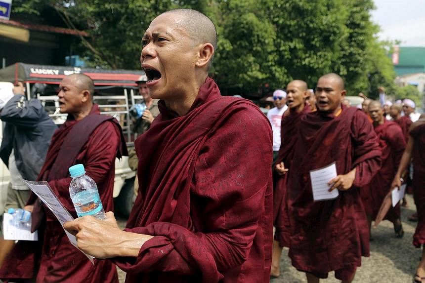 Buddhist monks shout during a march to denounce foreign criticism of the country's treatment of stateless Rohingya Muslims, in Yangon, Myanmar, on May 27, 2015. About 500 Buddhist hardliners, backed by monks, gathered in Sittwe, in troubled Rakhine s