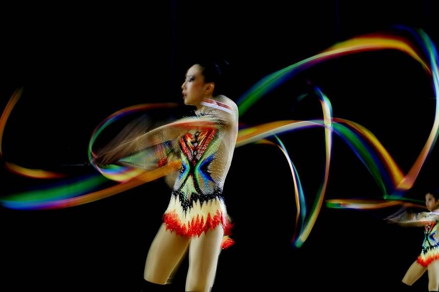 Singapore's rhythmic gymnasts warming up before the group all-around event at the Bishan Sports Hall on June 14, 2015. -- PHOTO: SINGAPORE SEA GAMES ORGANISING COMMITTEE/ACTION IMAGES VIA REUTERS