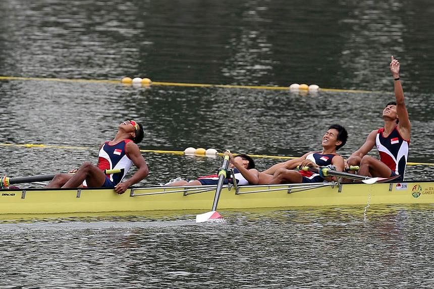Singapore's men's&nbsp;lightweight coxless four team of (from left)&nbsp;Nadzrie Hyckell Hamazah, Lee Zong Han, Pek Hong Kiat and Syahir Ezekiel Rafaee&nbsp;celebrating after coming in second in the 1,000m event on June 14, 2015.&nbsp;-- ST PHOTO:&nb