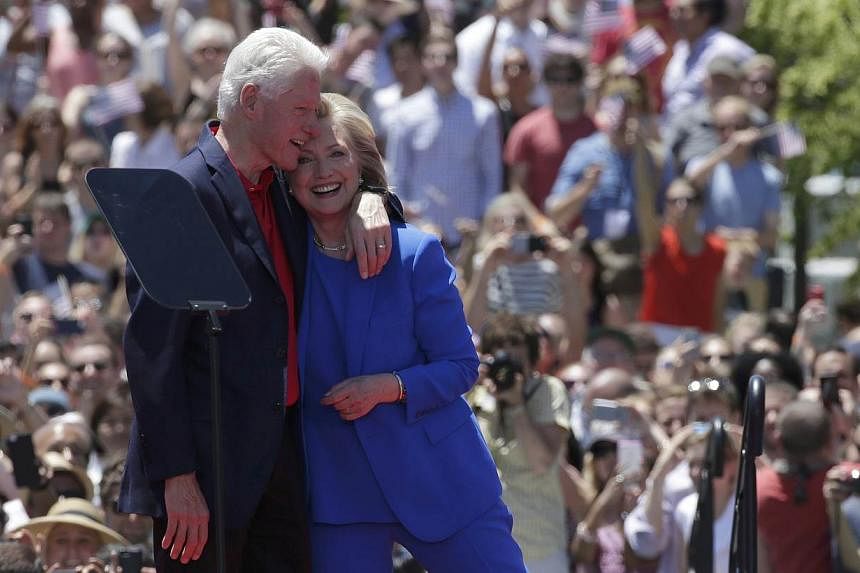 US Democratic presidential candidate Hillary Clinton is embraced by her husband, former president Bill Clinton, after she delivered her "official launch speech" at a campaign kick-off rally in Franklin D. Roosevelt Four Freedoms Park on Roosevelt Isl
