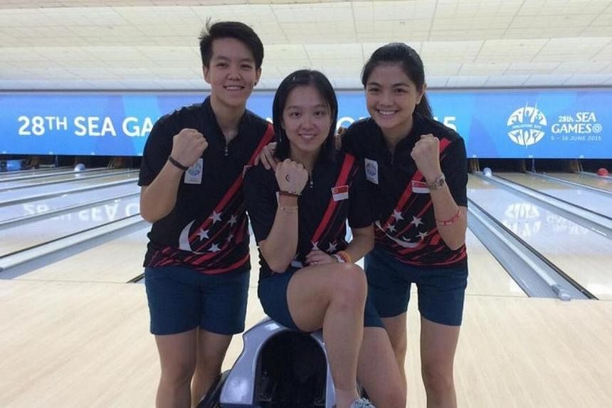 A fourth bowling gold medal for Singapore is guaranteed after keglers (from left) Shayna Ng, Jazreel Tan and Daphne Tan filled all three stops in the women's stepladder finals on June 14, 2015. -- ST PHOTO: JONATHAN WONG&nbsp;