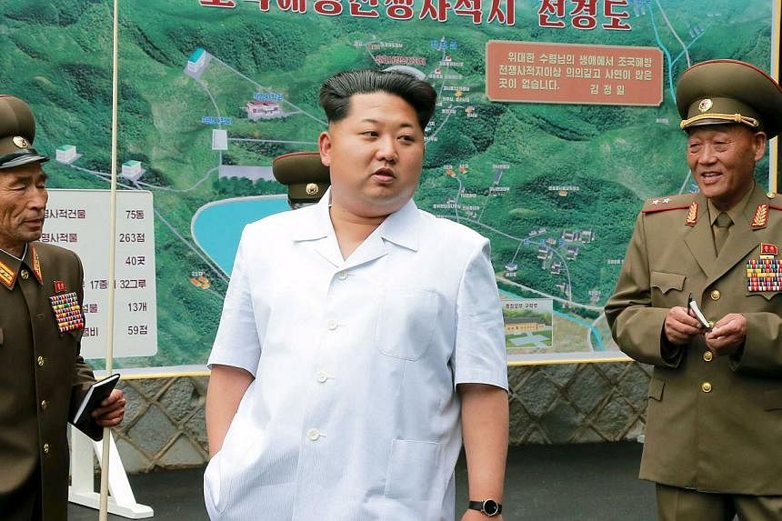 North Korean leader Kim Jong Un (centre) gives field guidance at a historic site associated with the Korean War in this undated photograph released by North Korea's Korean Central News Agency (KCNA) in Pyongyang on June 9, 2015. -- PHOTO: REUTERS