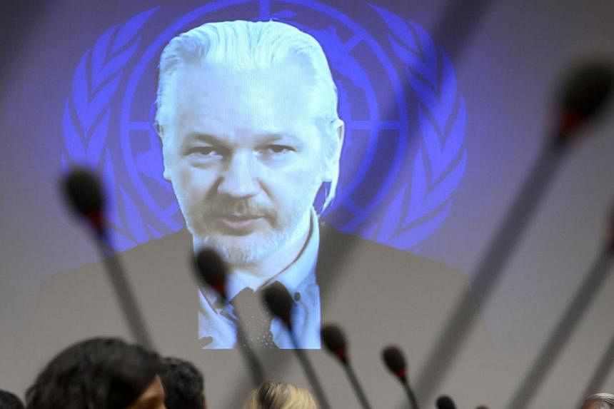 WikiLeaks founder Julian Assange is seen on a screen speaking via web cast from the Ecuadorian Embassy in London during an event on the sideline of the United Nations (UN) Human Rights Council session on March 23, 2015 in Geneva.&nbsp;Swedish prosecu