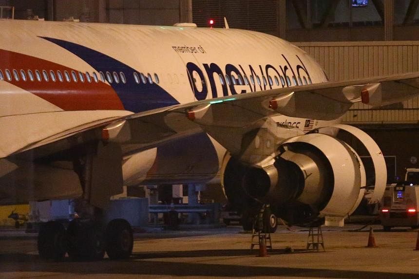 Malaysian Airlines aircraft flight MH148 sits on the tarmac at Melbourne Tullamarine Airport, Melbourne, Australia on June 12, 2015. -- PHOTO: EPA
