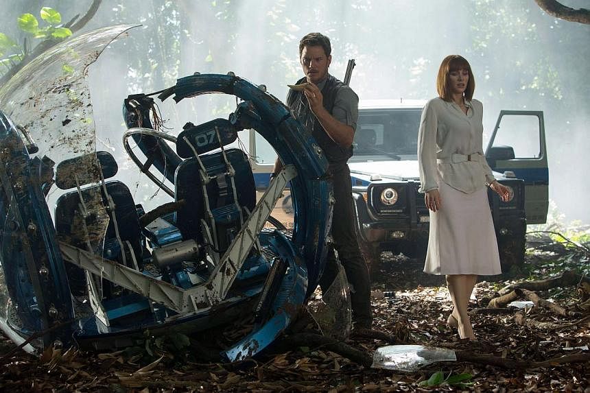 Still from the movie Jurassic World starring Chris Pratt (left) and Bryce Dallas Howard. The action-packed movie, featuring a new and particularly lethal hybrid dinosaur, debuted in global cinemas with a whopping US$511 million (S$688.7 million), sai