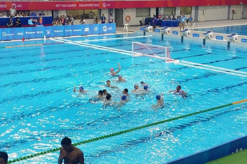 The Republic's men's water polo team sealed their 26th consecutive gold with a hard-fought 15-10 win over Indonesia on Tuesday (June 16) afternoon at the OCBC Aquatic Centre. -- ST PHOTO: ISAAC NEO
