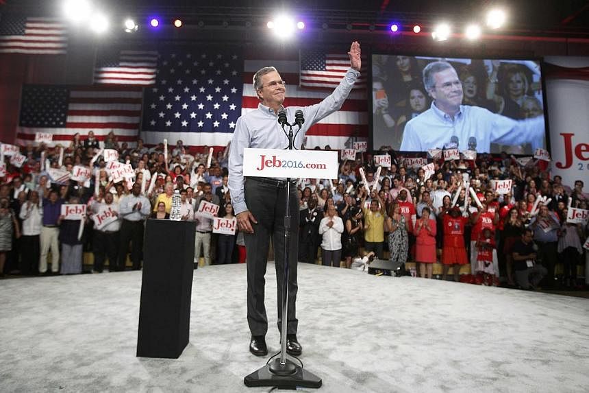 Republican US presidential candidate and former Florida Governor Jeb Bush waving as he arrives to formally announce his campaign for the 2016 Republican presidential nomination during a kickoff rally in Miami, Florida on June 15, 2015. -- PHOTO: REUT