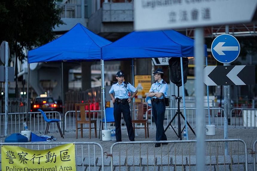 Police stand guard by a roundabout outside the Legislative Council in Hong Kong, China, on June 15, 2015. -- PHOTO: EPA