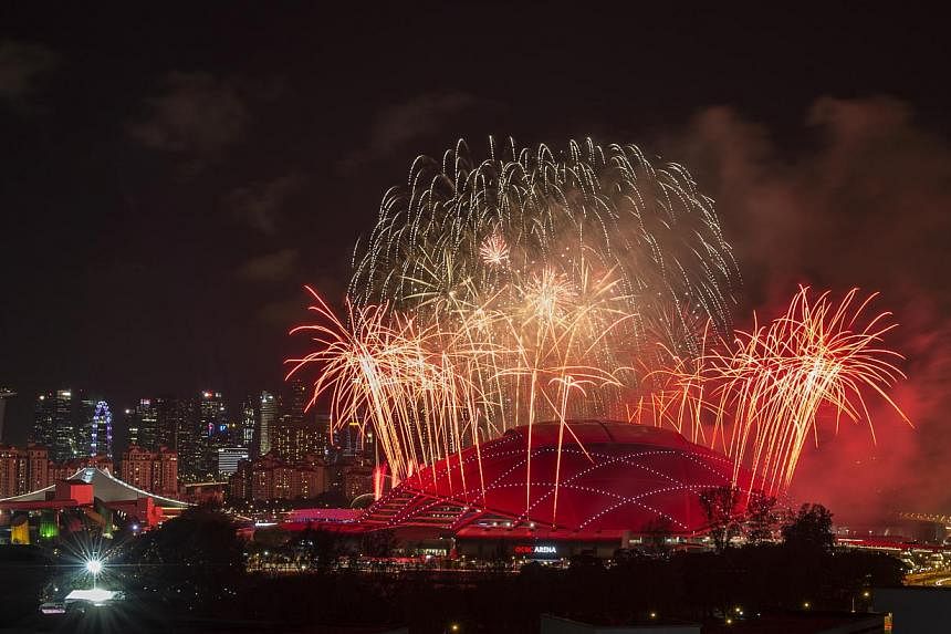 Fireworks on display above the Sports Hub during the 28th SEA Games opening ceremony on June 5, 2015. -- ST PHOTO: DESMOND WEE