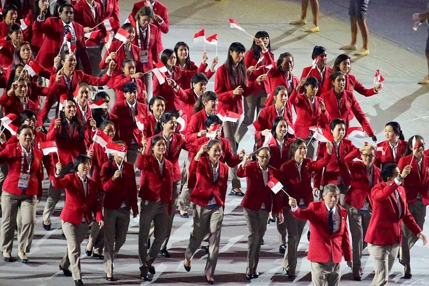 The Singapore contingent marching past during the opening ceremony of the 28th SEA Games at the Singapore Sports Hub on June 5, 2015. -- PHOTO: THE NEW PAPER