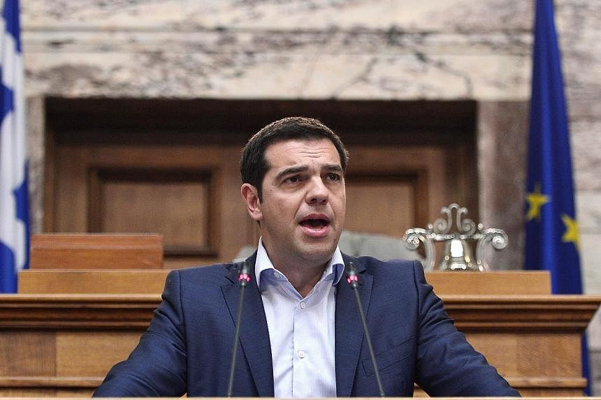 Greek Prime Minister Alexis Tsipras addresses his MP's and ministers at the Greek Parliament in Athens on June 16, 2015. -- PHOTO: AFP
