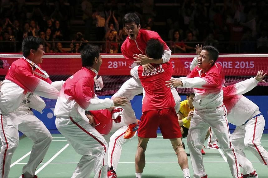 The Indonesia team celebrating on court after they beat Thailand in the badminton men's team final on June 12, 2015. -- PHOTO: SINGAPORE SEA GAMES ORGANISING COMMITTEE/ACTION IMAGES VIA REUTERS&nbsp;