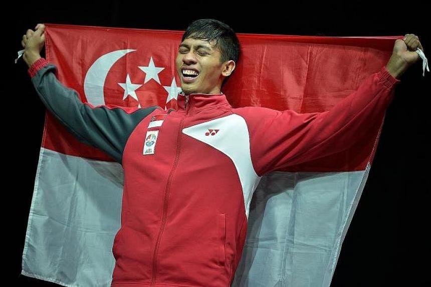 Silat fighter Muhammad Nur Alfian Juma'en crying at the medal ceremony after winning gold in the men's tanding F Class. His gold was the only win for silat - a win that mattered greatly to the sport, the fans and him.