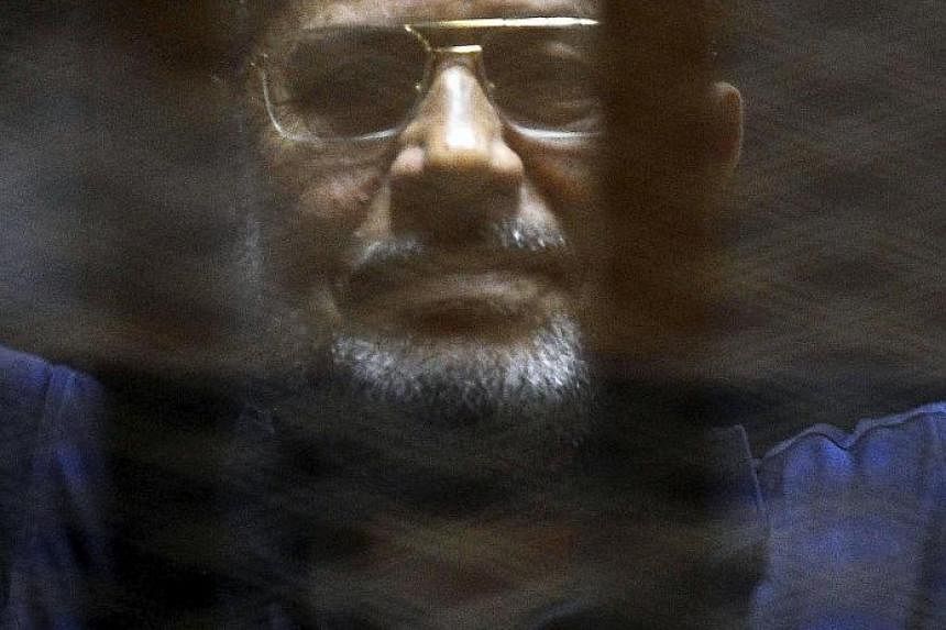 Mohamed Mursi in court yesterday. He had been convicted of killing and kidnapping policemen, and jailbreak.