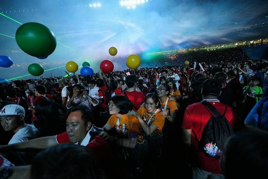 Athletes and volunteers partying together at the National Stadium after the 28th SEA Games closing ceremony last night. In a sweet show of athletic brotherhood, athletes from all 11 participating countries walked in together as one vast contingent fo