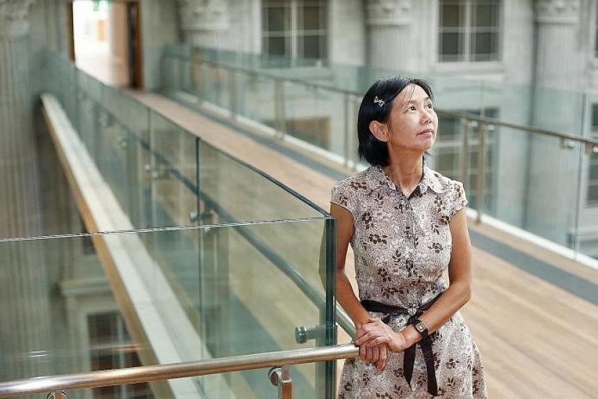 Volunteer guide Tan Hui Kheng says that the National Gallery is impressive even without the artworks. One of the highlights of the new building is the roof, made of 15,000 aluminium panels in shades of gold that extends from the old Supreme Court bui
