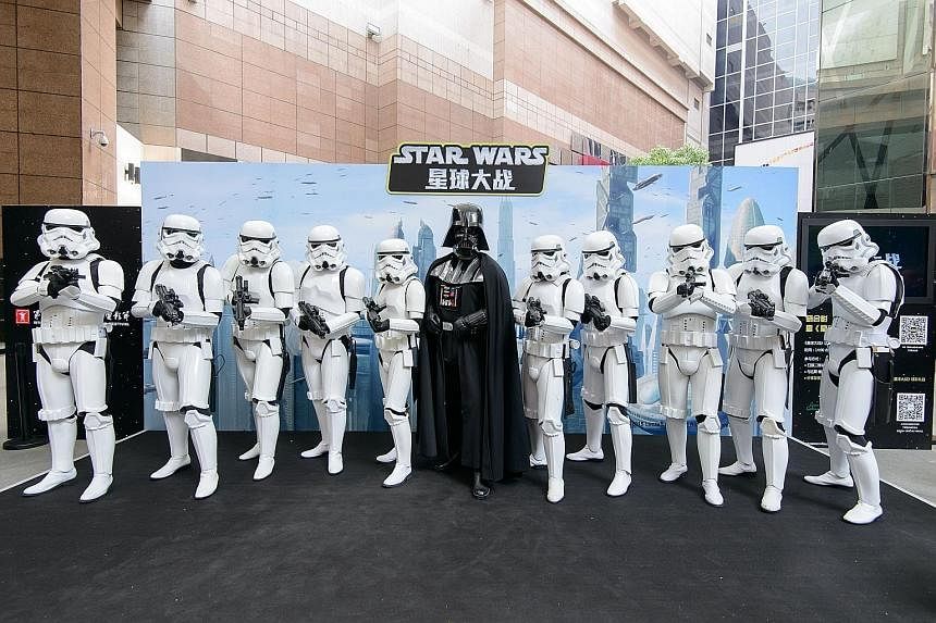 Taking China by storm... Star Wars characters Darth Vader and StormTroopers at the Shanghai International Film Festival this week.