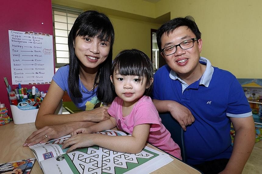Renae, who turns five in August, with her parents, Mr Tong Peng Geat and Ms Ray Khorsuk. She was tested at three and found to have an IQ of 140. An average child's IQ is 100. Tricia, who turns four this year, with her parents, Mr Loke Chok Loon and M
