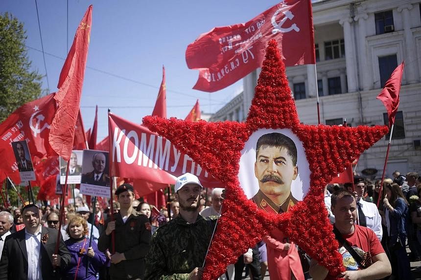 People carrying a portrait of Soviet leader Josef Stalin as they marked the 70th anniversary of the end of World War II last month in Sevastopol city, the subject of a territorial row between Russia and Ukraine.