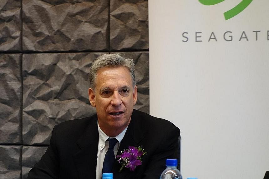 The Singapore Seagate Design Centre (above) will focus on developing a new generation of 2.5-inch storage drives, as the firm makes the most of Singapore's cutting-edge facilities, says chairman Stephen Luczo (right).