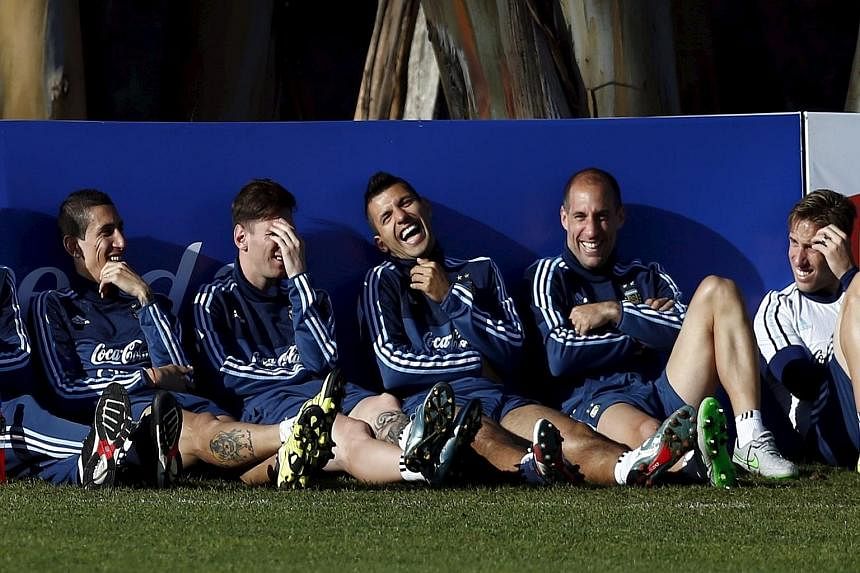 (From left) Argentina players Angel di Maria, Lionel Messi, Sergio Aguero and Pablo Zabaleta relaxing at a training session for the Copa America. While striker Aguero admits that he has tried to persuade Messi to leave Barcelona and join him at Manch