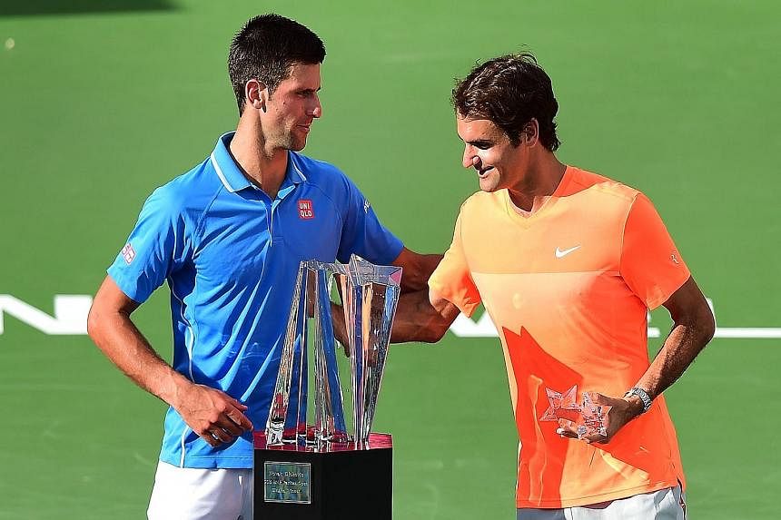 Novak Djokovic (left) and Roger Federer chatting before the trophy presentation for the BNP Paribas Open in Indian Wells, California in March, when the Serb won 6-3, 6-7 (5-7), 6-2. The Swiss legend says that while the great rivals are not close, the