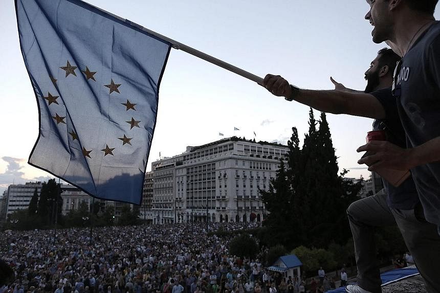 Greek demonstrators outside Parliament calling for the country to remain in the euro zone.