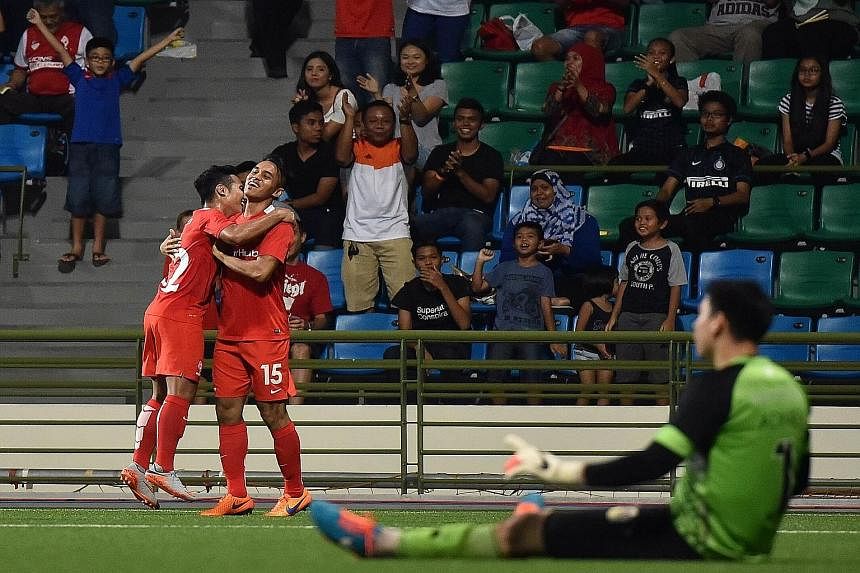Shahdan Sulaiman (No. 15) celebrating with Sahil Suhaimi after scoring the LionsXII's third goal, upon his return from a horrific broken ankle at last year's AFF Suzuki Cup.