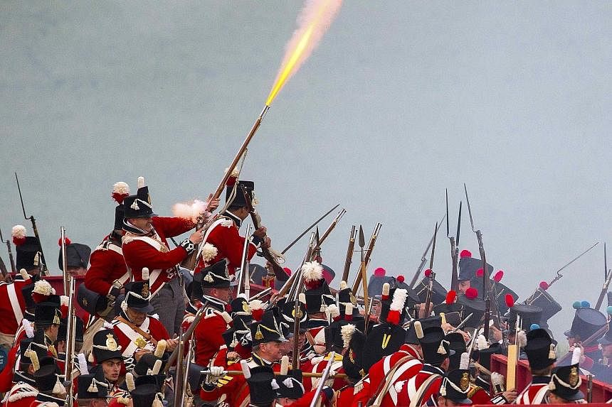 Performers re-enacting "The French Attack" to mark the 200th anniversary of the Battle of Waterloo, in Waterloo, Belgium, last Friday. Allied forces defeated Napoleon's army in 1815, changing the course of history in Europe.