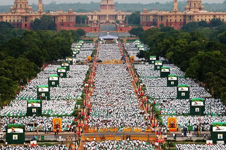 NEW DELHI: Thousands of participants performing yoga in Rajpath boulevard yesterday to mark the first International Day of Yoga.