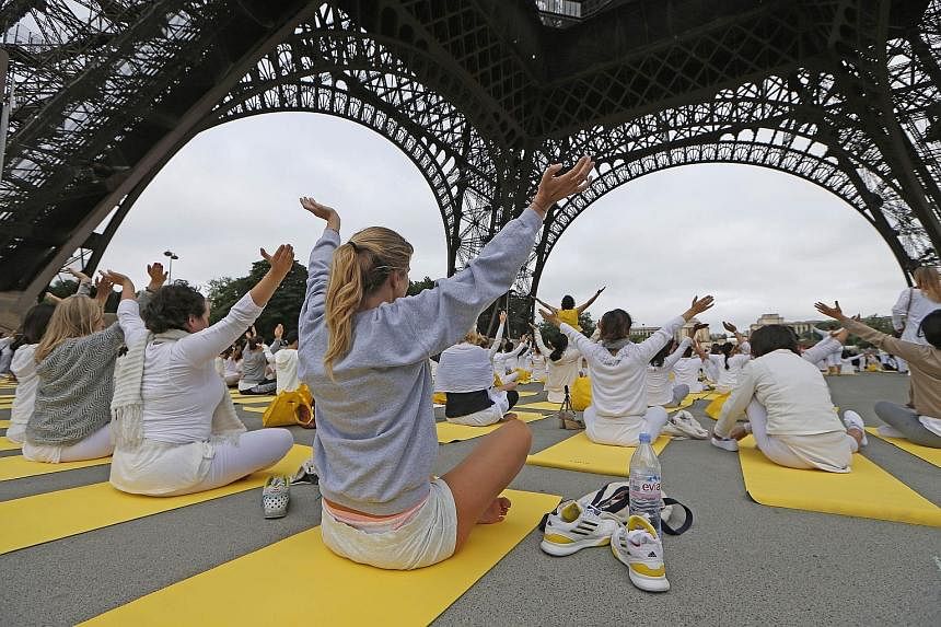 PARIS: Hundreds of participants attended a session under the Eiffel Tower in Paris. India was to be joined by yoga enthusiasts in 192 other countries for the event.