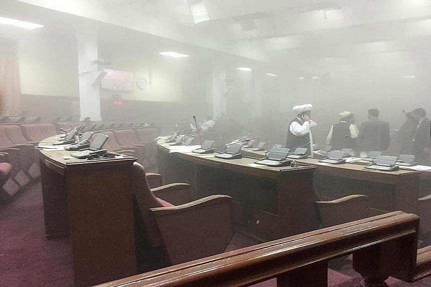 Lawmakers inside a smoke-filled Parliament after the attack, in a handout picture from Afghan MP Najibullah Faiq. Kabul police chief Abdul Rahman Rahimi said all lawmakers were safe.