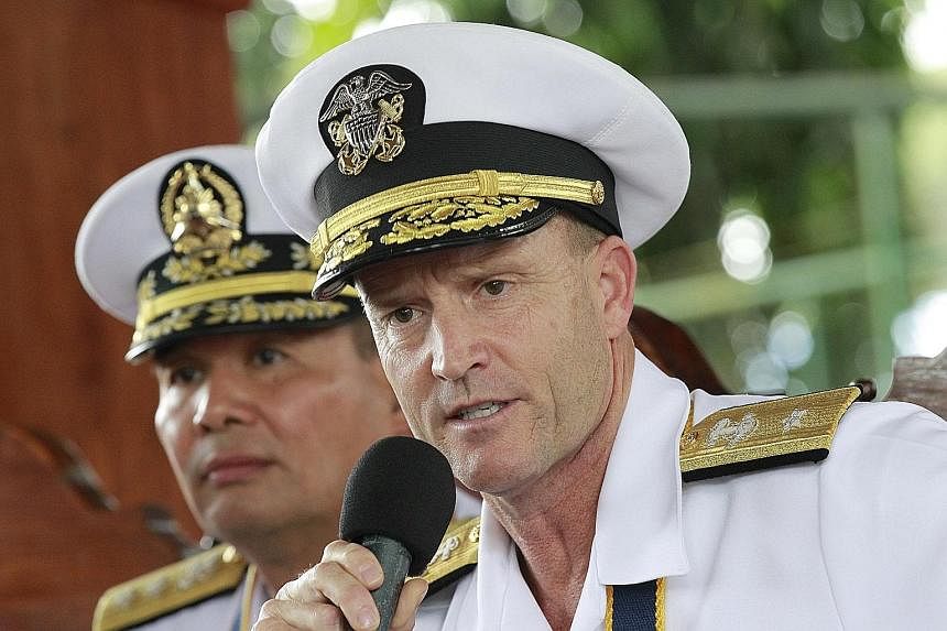 US Navy Rear Admiral William Merz meeting the press after yesterday's opening ceremony of the annual joint military exercise with the Philippines off Palawan island. US military forces aboard amphibious assault vehicles in the South China Sea during 