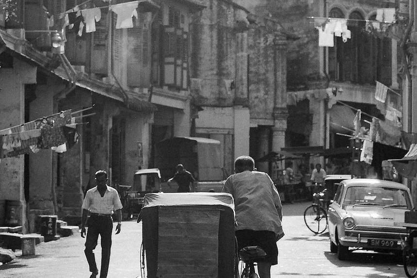 On Our Way To Pasar Malam (1968, above), digital print on archival paper: Loke favours this shot of street vendors pushing their carts along Circuit Road near Aljunied, as it is "layered". He explains: "In the foreground, you have the hawkers. By the