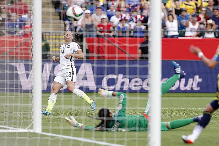 Striker Alex Morgan scores to set the United States on their way to a 2-0 last-16 victory over Colombia in the Women's World Cup. The US will meet China in the last eight, a repeat of the 1999 final.