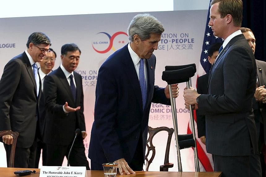 US Secretary of State John Kerry, who hurt his leg in a cycling accident last month, leaving after a climate change session at the seventh US-China Strategic and Economic Dialogue in Washington on Tuesday. He said the cooperation on environmental iss