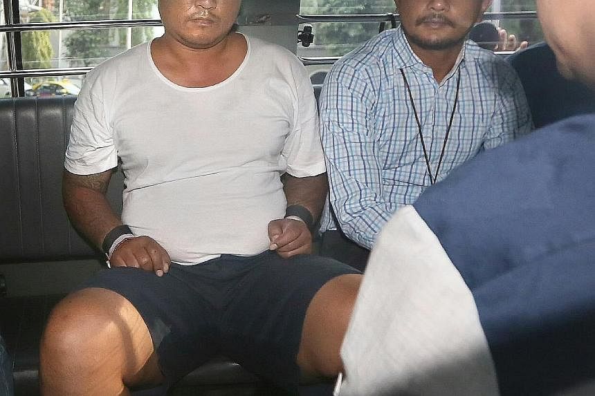 (From left) Myanmar nationals Phyo Min Naing and Yae Wynnt Oaung (wearing spectacles), and Singapore PR Zaw Min Hlaing were yesterday charged with abetment by conspiracy to murder Mr Aye Maung Maung Thet, a Singapore PR. A fourth man who was involved