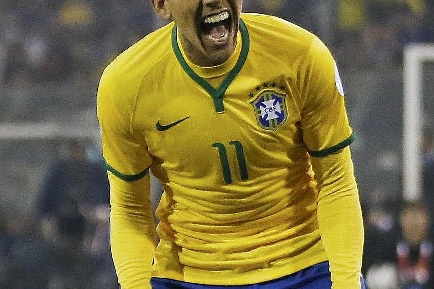 Roberto Firmino is elated after scoring in Brazil's 2-1 Copa America group-stage win over Venezuela.