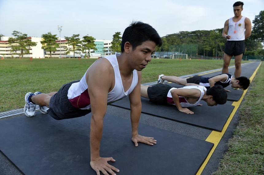 NSmen doing push-ups at Maju Camp.