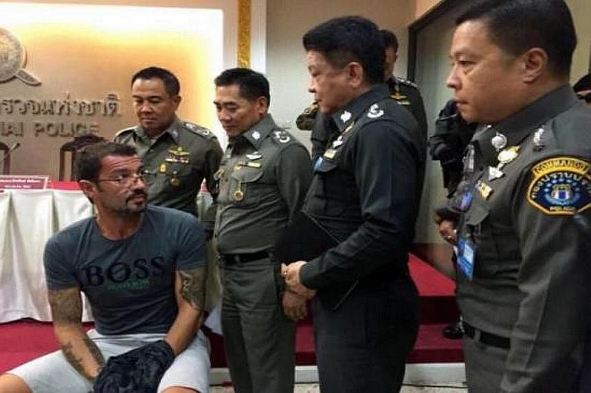 Xavier Andre Justo (left) appearing before the media after being arrested in Thailand on Monday for seeking 2.5 million Swiss francs (S$3.6 million) from PetroSaudi in exchange for not disclosing confidential company information, including alleged wr