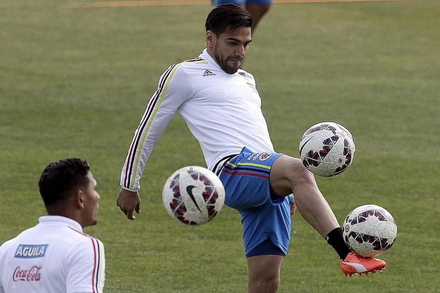 Radamel Falcao (right, in training) will hope that he can break his duck in the Copa when Colombia take on Argentina in the quarter-finals.