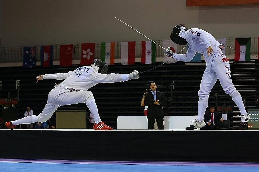 The unheralded world No. 107 from China, Jiao Yunlong, lunging to score a point in his razor-thin 11-10 win over the highest-ranked fencer in the epee discipline, world No. 6 Park Kyoung Doo from South Korea.