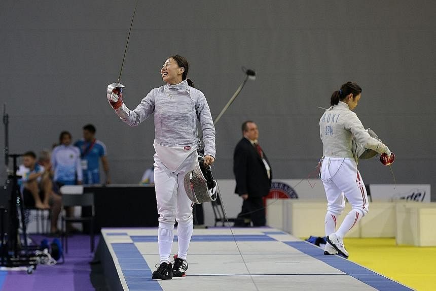Shen Chen of China celebrating her 15-7 win over Chika Aoki in the sabre final, following two bronzes in the last two editions of the championships.