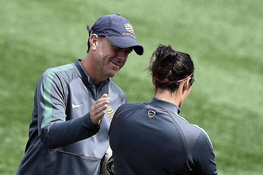 Australia coach Alen Stajcic encouraging a player during training. The shock win over Brazil put them into the quarter-finals of the Women's World Cup for the third time running.