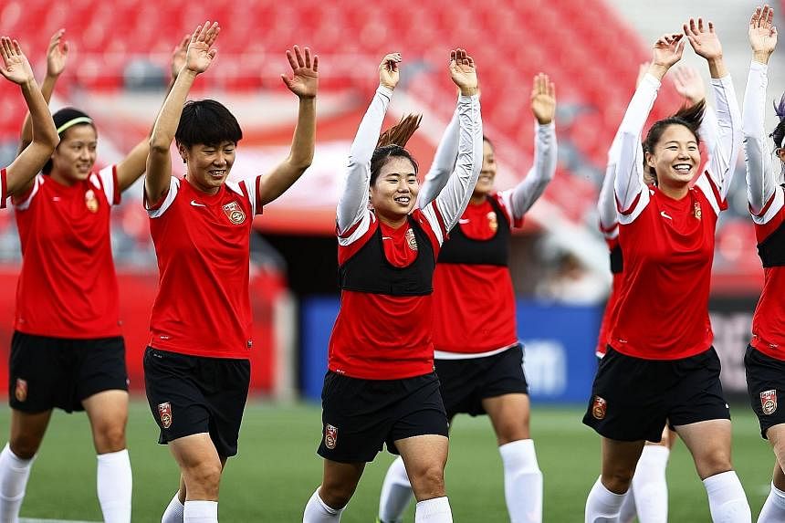 The Chinese women's football team training at Lansdowne Stadium in Ottawa, Ontario on the eve of their World Cup quarter-final against the US, a repeat of the 1999 final in California.