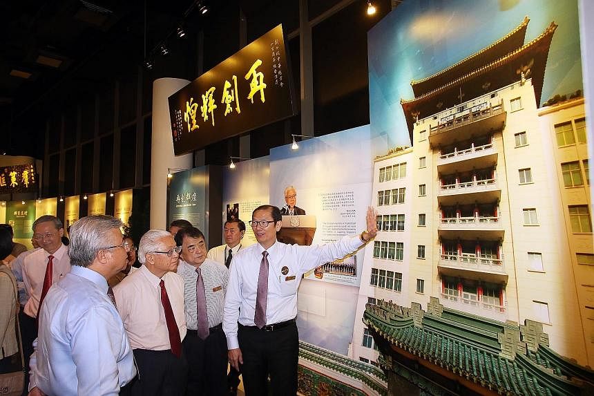 President Tan (second from left) with (from left) SCCCI president Thomas Chua, vice-president Wu Hsioh Kwang and honorary council member Seow Choke Meng at the exhibition yesterday.