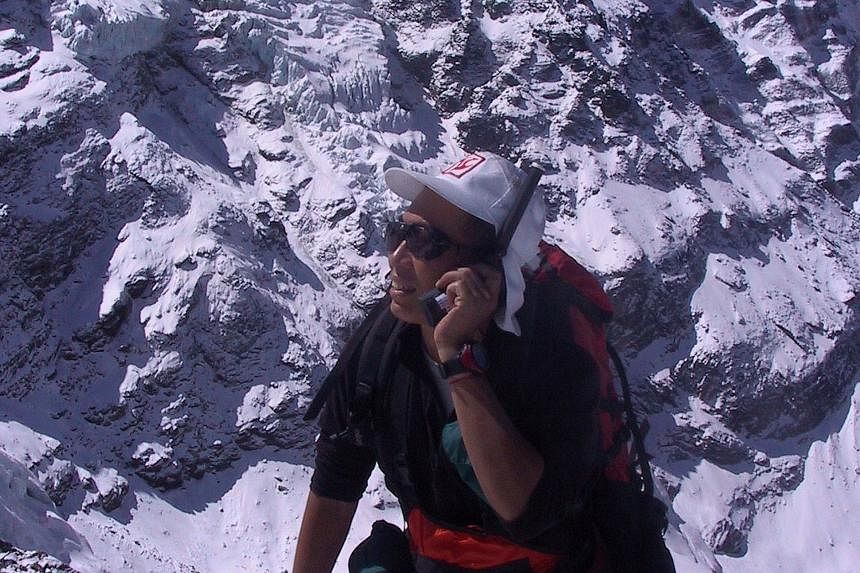 Veteran climber David Lim, seen here using a satellite phone in the Hinku Valley in Nepal, says risks can be controlled only so far.