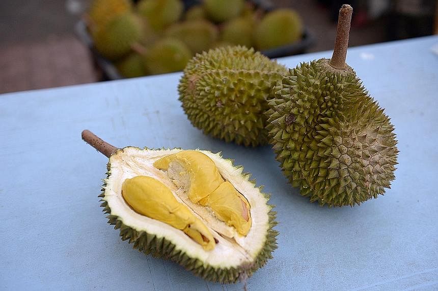 Pesticide-free durians from 818 Durians & Pastries (top) and the $5 durians from Delight Fruit Trading (above).